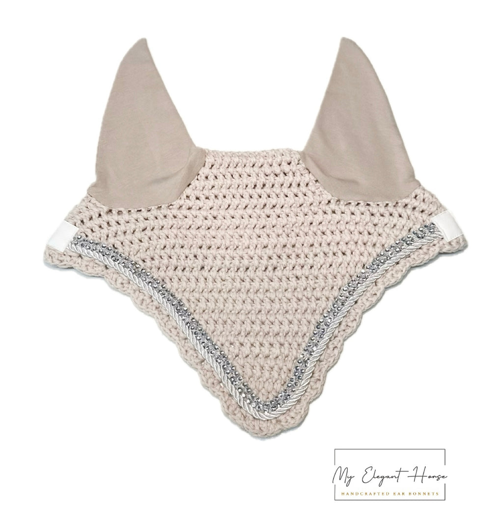 ALEHINTAINEN BEIGE PYÖREÄREUNAINEN KORVAHUPPU.