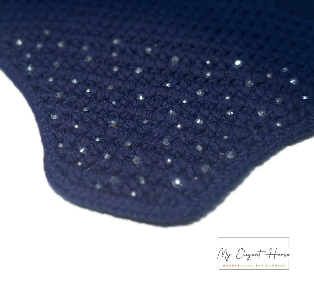 TUMMANSININEN NELIÖREUNAINEN KORVAHUPPU