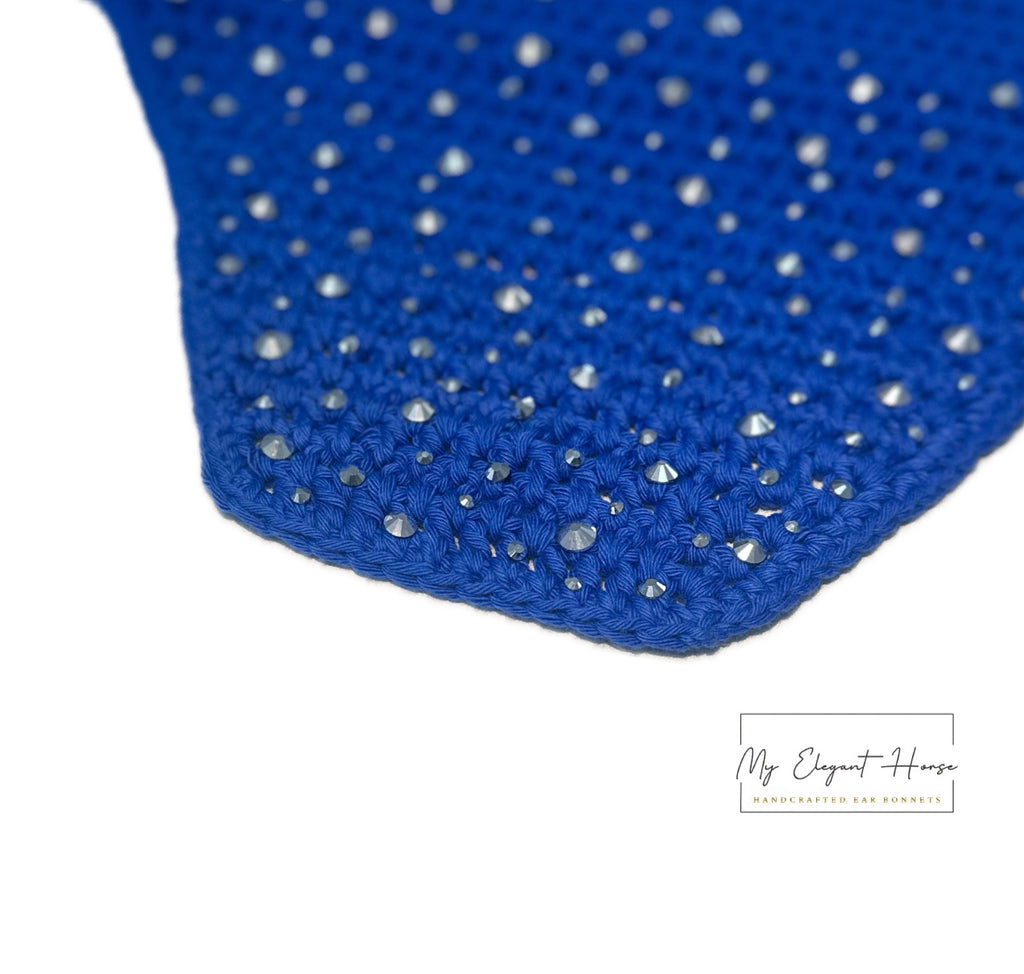 KIRKKAANSININEN NELIÖREUNAINEN KORVAHUPPU